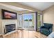 Bright bedroom with fireplace, private balcony, and waterfront views at 140 Brent Cir, Oldsmar, FL 34677