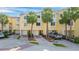 Attractive townhome exterior with attached garages and manicured landscaping at 140 Brent Cir, Oldsmar, FL 34677