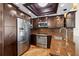 Updated kitchen features stainless steel appliances, custom cabinetry, and wood floors at 140 Brent Cir, Oldsmar, FL 34677