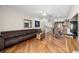 Spacious living room with hardwood floors, modern decor and open floor plan at 140 Brent Cir, Oldsmar, FL 34677