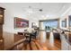 Open living space with hardwood floors, access to a waterfront balcony, and modern furnishings at 140 Brent Cir, Oldsmar, FL 34677
