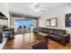 Spacious living room with water views through sliding glass doors to the balcony at 140 Brent Cir, Oldsmar, FL 34677