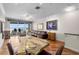 Bright living room featuring hardwood floors, waterfront views, and a ceiling fan at 140 Brent Cir, Oldsmar, FL 34677