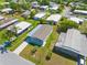 Aerial view of the neighborhood showcasing the home with covered parking and landscaping at 14383 Dehaven Ave, Brooksville, FL 34613