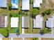 Drone's eye view of the home's location in a peaceful, manicured neighborhood with pristine landscaping and easy street access at 14383 Dehaven Ave, Brooksville, FL 34613
