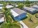 Charming single-story home features a new driveway, light gray facade, and a spacious carport in a tranquil community at 14383 Dehaven Ave, Brooksville, FL 34613