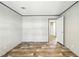 Bedroom view includes an ensuite bathroom and showcases ample floor space and neutral color scheme at 14383 Dehaven Ave, Brooksville, FL 34613