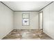 Bedroom features a large window and neutral walls providing a calming and inviting atmosphere at 14383 Dehaven Ave, Brooksville, FL 34613