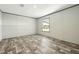 This is a bedroom featuring wood floors and a window for natural light at 14383 Dehaven Ave, Brooksville, FL 34613