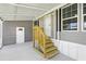 Exterior view of home showing a covered parking area with steps leading to the front door at 14383 Dehaven Ave, Brooksville, FL 34613