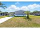 Exterior of home with a driveway, landscaping, and covered parking on a sunny day at 14383 Dehaven Ave, Brooksville, FL 34613