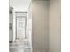 Hallway showcasing neutral walls, wood-look vinyl floors, and a white front door at 14383 Dehaven Ave, Brooksville, FL 34613