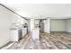 Well-equipped kitchen featuring a center island, stainless appliances and modern flooring at 14383 Dehaven Ave, Brooksville, FL 34613