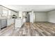 Spacious kitchen with stainless steel appliances and island provides ample space for cooking and entertaining at 14383 Dehaven Ave, Brooksville, FL 34613
