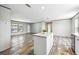 Kitchen island providing extra space for dining and food preparation, with an open living area at 14383 Dehaven Ave, Brooksville, FL 34613