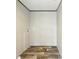 A laundry room with hookups for washer and dryer and neutral-colored walls at 14383 Dehaven Ave, Brooksville, FL 34613