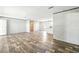 Spacious living room featuring modern flooring, neutral walls and lots of natural light at 14383 Dehaven Ave, Brooksville, FL 34613