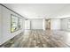 Bright, open living space featuring modern flooring and plenty of natural light at 14383 Dehaven Ave, Brooksville, FL 34613