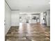 Open-concept living space with stainless appliances and modern flooring at 14383 Dehaven Ave, Brooksville, FL 34613