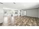 Bright open living space featuring modern flooring, stainless appliances and natural light at 14383 Dehaven Ave, Brooksville, FL 34613