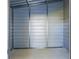 Interior view of a metal storage shed with ample room for organizing equipment at 14383 Dehaven Ave, Brooksville, FL 34613