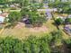 Aerial view of the community playground surrounded by lush greenery and neighborhood homes at 1511 Woonsocket Ln, Brandon, FL 33511