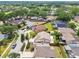 The aerial photo shows the home's position in a quiet neighborhood with green spaces and a well kept lawn at 1511 Woonsocket Ln, Brandon, FL 33511