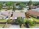 Bird's eye view of the property showcasing landscaping, fenced backyard, and surrounding neighborhood at 1511 Woonsocket Ln, Brandon, FL 33511