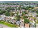 Aerial view of a residential neighborhood with tree-lined streets and well-maintained homes at 1511 Woonsocket Ln, Brandon, FL 33511