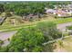 Community aerial view showcases a playground surrounded by landscaped greenery and nearby residences at 1511 Woonsocket Ln, Brandon, FL 33511