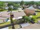 The aerial view captures the property's location, lush greenery, fenced yard and overall curb appeal at 1511 Woonsocket Ln, Brandon, FL 33511