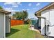 The backyard has a grassy lawn, providing space for outdoor activities, and has AC and satelite hookups at 1511 Woonsocket Ln, Brandon, FL 33511