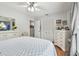 Well-lit bedroom with hardwood floors, providing comfortable space and closet access at 1511 Woonsocket Ln, Brandon, FL 33511