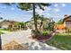 Single-Gathering home featuring a landscaped yard, mature trees, two-car garage and a well-maintained lawn at 1511 Woonsocket Ln, Brandon, FL 33511