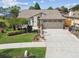 Attractive single-story home boasting a well-maintained lawn, neat landscaping, and a convenient two-car garage at 1511 Woonsocket Ln, Brandon, FL 33511
