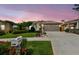 Charming single-story home featuring a well-manicured lawn, beautiful landscaping, and a spacious two-car garage at 1511 Woonsocket Ln, Brandon, FL 33511