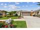 Lovely one-story home with a lush green lawn, lovely flower beds, and a double garage at 1511 Woonsocket Ln, Brandon, FL 33511