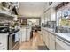 Bright kitchen with stainless appliances, granite counters, and views of the dining area at 1511 Woonsocket Ln, Brandon, FL 33511