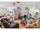 Open living room featuring smooth tile flooring, lots of seating, and ample natural light at 1511 Woonsocket Ln, Brandon, FL 33511