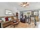 Comfortable living room featuring lots of seating, a ceiling fan, and tile flooring at 1511 Woonsocket Ln, Brandon, FL 33511