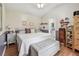 Comfortable main bedroom with ensuite bathroom, seating, and ample storage cabinets and drawers at 1511 Woonsocket Ln, Brandon, FL 33511