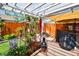 Charming patio with garden decor, string lights, and a welcoming atmosphere at 1511 Woonsocket Ln, Brandon, FL 33511