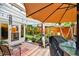 Outdoor patio with shaded seating, lush greenery, and a cozy ambiance at 1511 Woonsocket Ln, Brandon, FL 33511