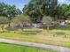 Community playground with mature trees, open spaces, and recreational equipment for outdoor fun at 1511 Woonsocket Ln, Brandon, FL 33511