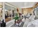 Comfortable sunroom featuring neutral tones, a sliding glass door, and inviting furniture at 1511 Woonsocket Ln, Brandon, FL 33511