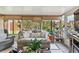 Inviting sunroom with comfortable seating, natural light, and views of the garden at 1511 Woonsocket Ln, Brandon, FL 33511