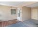 Enclosed front porch with a welcome mat and neutral walls at 1528 Chevy Chase Dr, Sun City Center, FL 33573