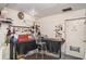 Organized garage space equipped with a workbench, ample lighting, and convenient tool storage at 1528 Chevy Chase Dr, Sun City Center, FL 33573