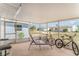 Relaxing screened-in patio furnished with a lounge chair and offering scenic views of the neighborhood at 1528 Chevy Chase Dr, Sun City Center, FL 33573