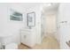 Bathroom featuring a sleek vanity, modern mirror, and glass shower door at 1601 Paloma Ln, Dunedin, FL 34698